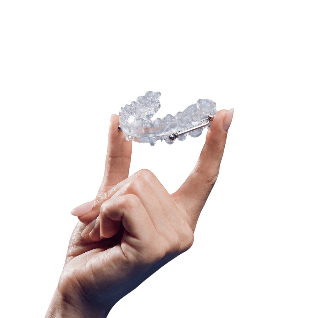 Person holding a mandibular advancement device for sleep apnea treatment